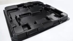 Black heavy gauge thermoformed packaging tray with multiple cavities