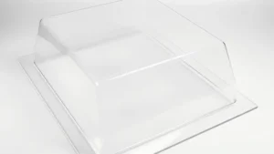 Clear acrylic vacuum formed cover with square design on a white background.