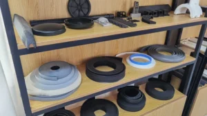 Collection of custom plastic extrusion profiles including rings, strips and channels
